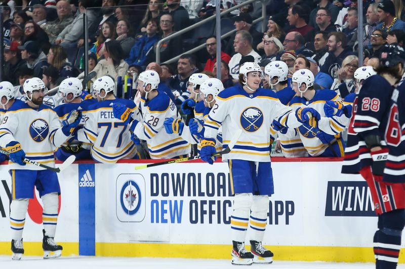 Jan 26, 2023; Winnipeg, Manitoba, CAN;  Buffalo Sabres forward Tage Thompson (72) is congratulated by his team mates on his goal against the Winnipeg Jets during the second period at Canada Life Centre. Mandatory Credit: Terrence Lee-USA TODAY Sports