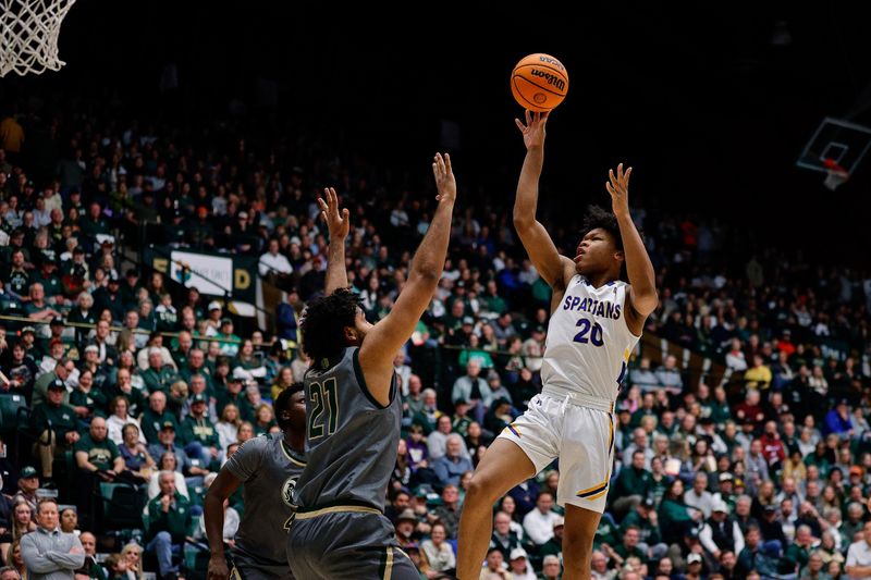 Feb 9, 2024; Fort Collins, Colorado, USA; San Jose State Spartans forward Christian Wise (20) attempts a shot against Colorado State Rams guard Rashaan Mbemba (21) in the first half at Moby Arena. Mandatory Credit: Isaiah J. Downing-USA TODAY Sports