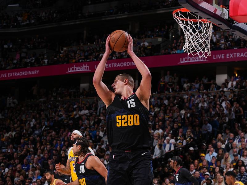 DENVER, CO - APRIL 22: Nikola Jokic #15 of the Denver Nuggets rebounds the ball during the game against the Los Angeles Lakers on April 22, 2024 at the Ball Arena in Denver, Colorado. NOTE TO USER: User expressly acknowledges and agrees that, by downloading and/or using this Photograph, user is consenting to the terms and conditions of the Getty Images License Agreement. Mandatory Copyright Notice: Copyright 2024 NBAE (Photo by Bart Young/NBAE via Getty Images)