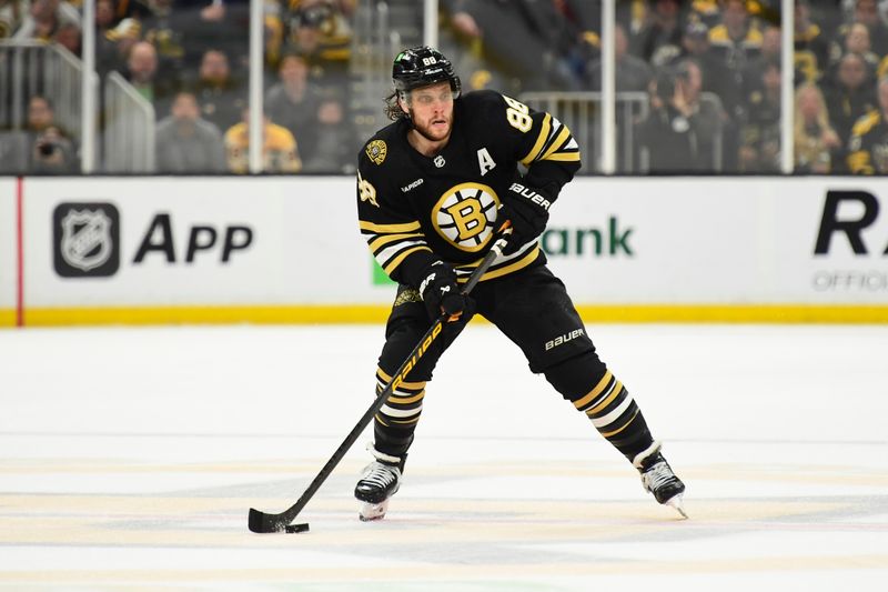 May 17, 2024; Boston, Massachusetts, USA; Boston Bruins right wing David Pastrnak (88) controls the puck during the third period in game six of the second round of the 2024 Stanley Cup Playoffs against the Florida Panthers at TD Garden. Mandatory Credit: Bob DeChiara-USA TODAY Sports