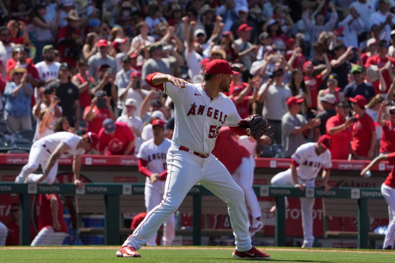 Jul 2, 2023; Anaheim, California, USA; Los Angeles Angels relief pitcher Carlos Estevez (53) celebrates at the end of the game against the Arizona Diamondbacks at Angel Stadium. Mandatory Credit: Kirby Lee-USA TODAY Sports