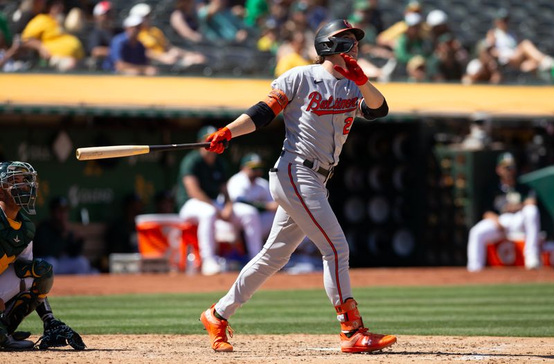 Aug 20, 2023; Oakland, California, USA; Baltimore Orioles designated hitter Gunnar Henderson (2) follows the flight of his solo home run against the Oakland Athletics during the seventh inning at Oakland-Alameda County Coliseum. Mandatory Credit: D. Ross Cameron-USA TODAY Sports