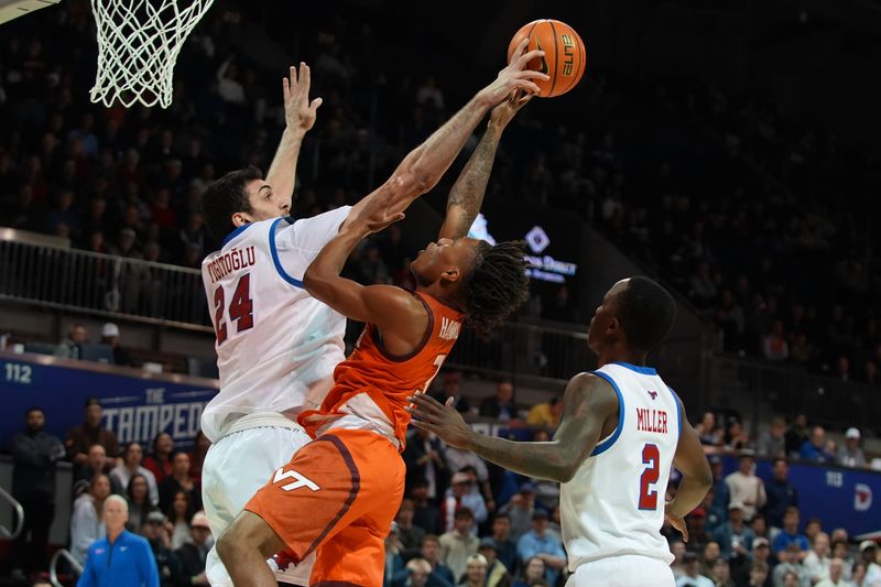 Jan 14, 2026; Dallas, Texas, USA;  SMU Mustangs center Samet Yigitoglu (24) blocks the shot attempt by. Virginia Tech Hokies guard Ben Hammond (3) during the first half at Moody Coliseum. Mandatory Credit: Raymond Carlin III-Imagn Images