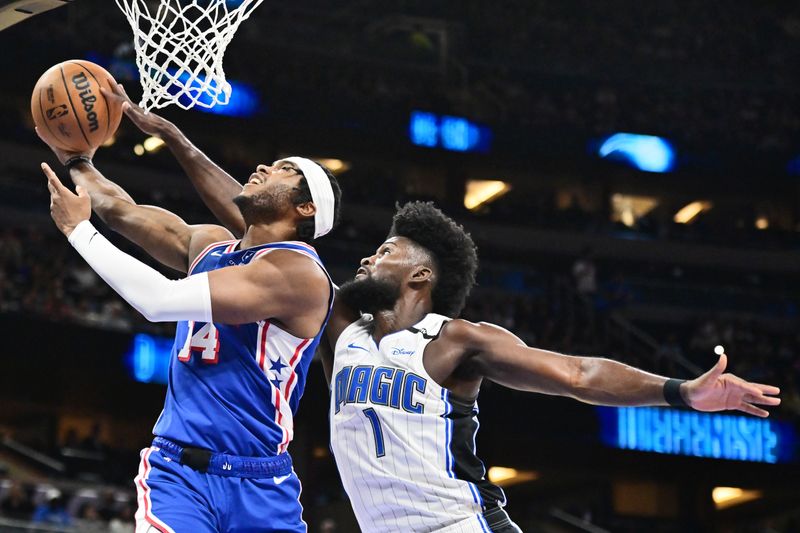 ORLANDO, FLORIDA - OCTOBER 18: Jonathan Isaac #1 of the Orlando Magic blocks a shot from Ricky Council IV #14 of the Philadelphia 76ers in the first half of a game at Kia Center on October 18, 2024 in Orlando, Florida. NOTE TO USER: User expressly acknowledges and agrees that, by downloading and or using this photograph, User is consenting to the terms and conditions of the Getty Images License Agreement. (Photo by Julio Aguilar/Getty Images)