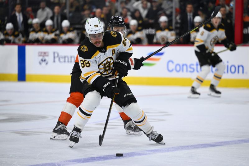 Nov 2, 2024; Philadelphia, Pennsylvania, USA; Boston Bruins right wing David Pastrnak (88) controls the puck against the Philadelphia Flyers in the first period at Wells Fargo Center. Mandatory Credit: Kyle Ross-Imagn Images
