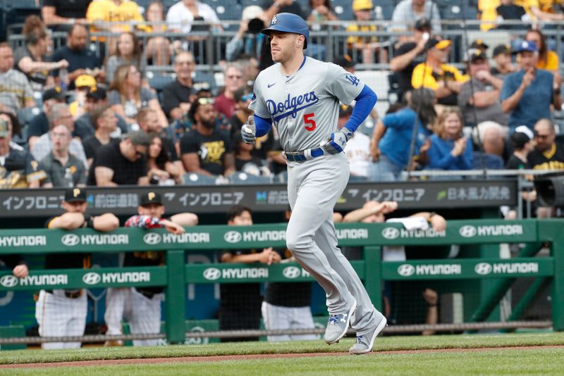 Jun 6, 2024; Pittsburgh, Pennsylvania, USA;  Los Angeles Dodgers first baseman Freddie Freeman (5) circles the bases on a three-run home run against the Pittsburgh Pirates during the first inning at PNC Park. Mandatory Credit: Charles LeClaire-USA TODAY Sports