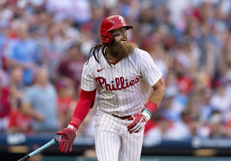 Jul 27, 2024; Philadelphia, Pennsylvania, USA;  Philadelphia Phillies outfielder Brandon Marsh (16) hits a two RBI home run during the fourth inning against the Cleveland Guardians at Citizens Bank Park. Mandatory Credit: Bill Streicher-USA TODAY Sports