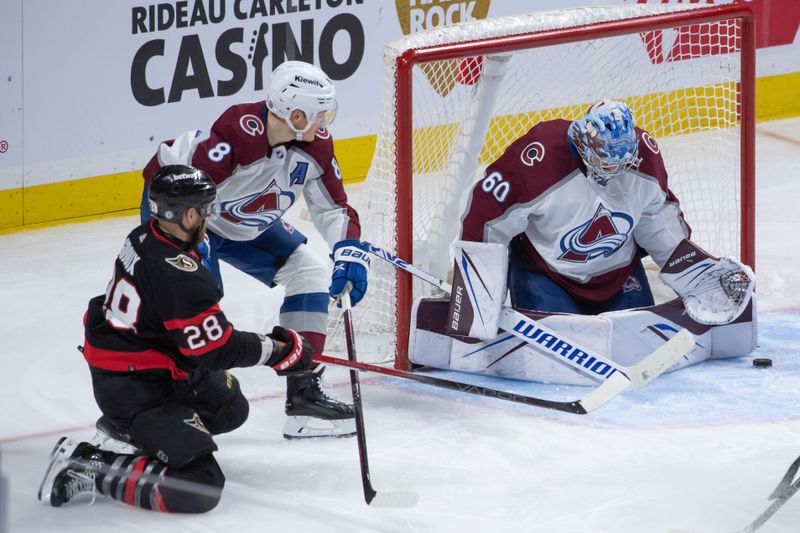 Jan 16, 2024; Ottawa, Ontario, CAN; Colorado Avalanche goalie Justus Annunen (60) makes a save in front of Ottawa Senators right wing Claude Giroux (28) in the third period at the Canadian Tire Centre. Mandatory Credit: Marc DesRosiers-USA TODAY Sports