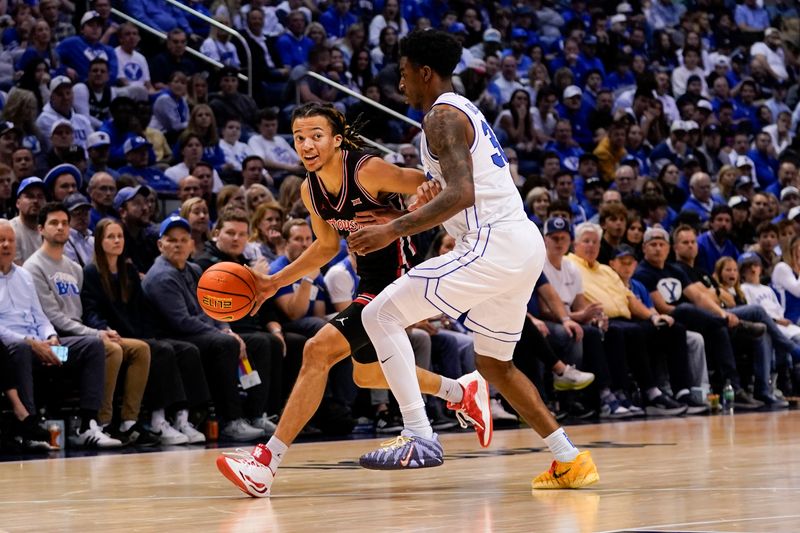 Feb 7, 2026; Provo, Utah, USA; Houston Cougars guard Kingston Flemings (4) controls the ball during the second half against the BYU Cougars  at Marriott Center. Mandatory Credit: Aaron Baker-Imagn Images
