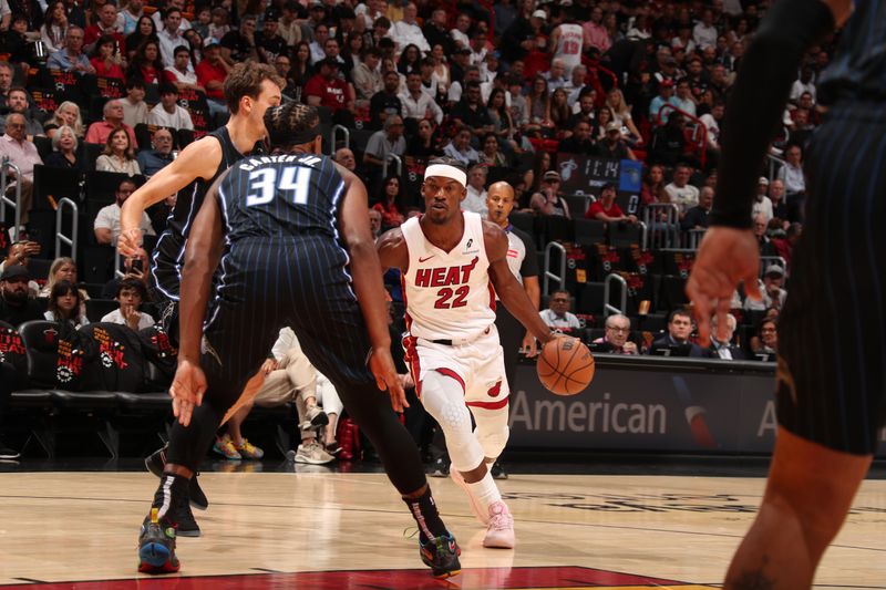 MIAMI, FL - OCTOBER 23: Jimmy Butler #22 of the Miami Heat handles the ball during the game against the Orlando Magic on October 23, 2024 at Kaseya Center in Miami, Florida. NOTE TO USER: User expressly acknowledges and agrees that, by downloading and or using this Photograph, user is consenting to the terms and conditions of the Getty Images License Agreement. Mandatory Copyright Notice: Copyright 2024 NBAE (Photo by Issac Baldizon/NBAE via Getty Images)