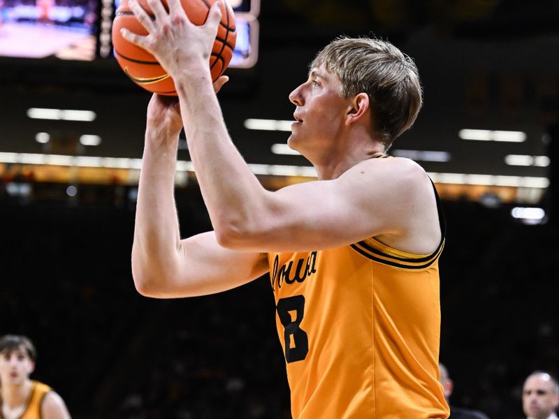 Feb 25, 2026; Iowa City, Iowa, USA; Iowa Hawkeyes forward Cooper Koch (8) shoots the ball against the Ohio State Buckeyes during the second half at Carver-Hawkeye Arena. Mandatory Credit: Jeffrey Becker-Imagn Images