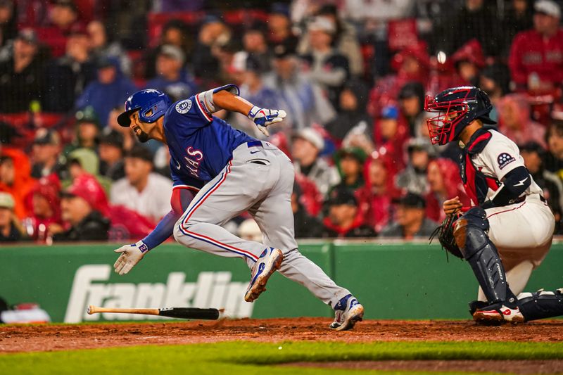 May 6, 2025; Boston, Massachusetts, USA; Texas Rangers second base Marcus Semien (2) hits a single against the Boston Red Sox in the fourth inning at Fenway Park. Mandatory Credit: David Butler II-Imagn Images