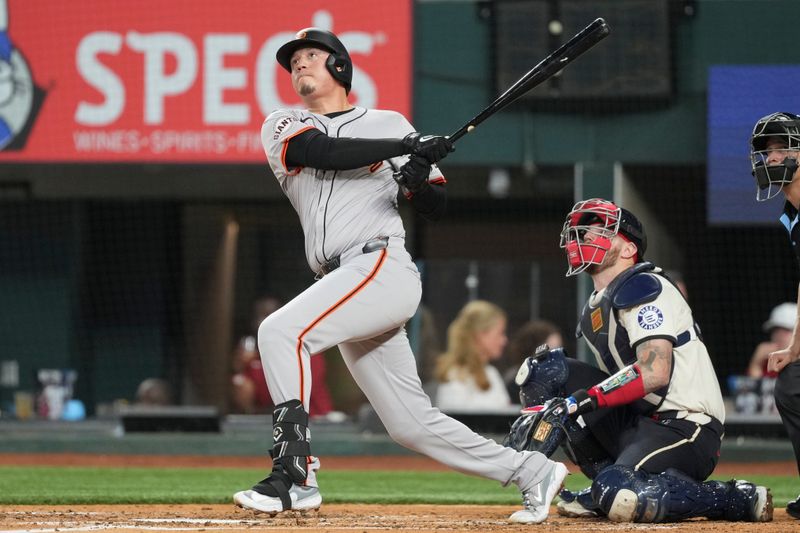 Jun 7, 2024; Arlington, Texas, USA; San Francisco Giants first baseman Wilmer Flores (41) follows through on his home run against the Texas Rangers during the fourth inning at Globe Life Field. Mandatory Credit: Jim Cowsert-USA TODAY Sports