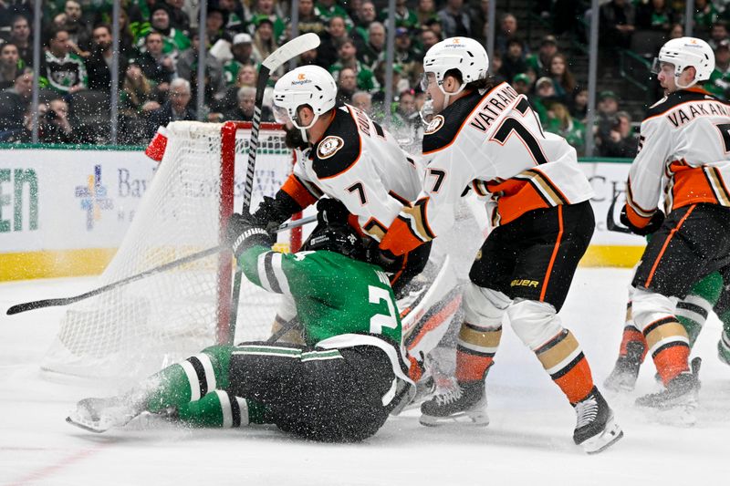 Jan 25, 2024; Dallas, Texas, USA; Anaheim Ducks defenseman Radko Gudas (7) and right wing Frank Vatrano (77) take down Dallas Stars center Roope Hintz (24) during the second period at the American Airlines Center. Mandatory Credit: Jerome Miron-USA TODAY Sports