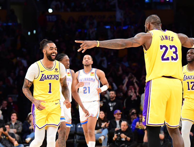 LOS ANGELES, CA - MARCH 4: D'Angelo Russell #1 and LeBron James #23 of the Los Angeles Lakers celebrates during the game against the Oklahoma City Thunder on March 4, 2024 at Crypto.Com Arena in Los Angeles, California. NOTE TO USER: User expressly acknowledges and agrees that, by downloading and/or using this Photograph, user is consenting to the terms and conditions of the Getty Images License Agreement. Mandatory Copyright Notice: Copyright 2024 NBAE (Photo by Adam Pantozzi/NBAE via Getty Images)