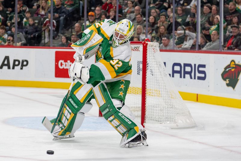 Nov 16, 2024; Saint Paul, Minnesota, USA; Minnesota Wild goaltender Filip Gustavsson (32) passes the puck against the Dallas Stars in the third period at Xcel Energy Center. Mandatory Credit: Matt Blewett-Imagn Images