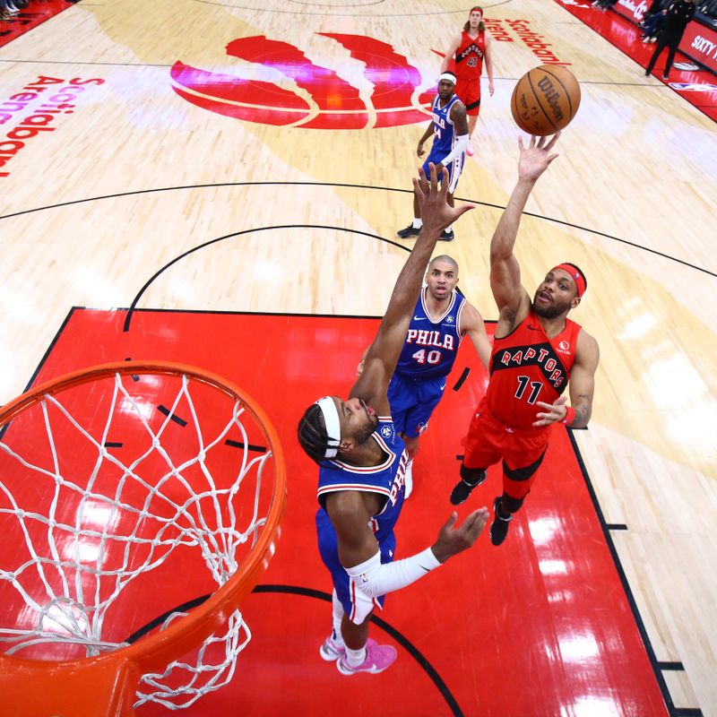 TORONTO, CANADA - MARCH 31: Bruce Brown #11 of the Toronto Raptors drives to the basket during the game against the Philadelphia 76ers on March 31, 2024 at the Scotiabank Arena in Toronto, Ontario, Canada.  NOTE TO USER: User expressly acknowledges and agrees that, by downloading and or using this Photograph, user is consenting to the terms and conditions of the Getty Images License Agreement.  Mandatory Copyright Notice: Copyright 2024 NBAE (Photo by Vaughn Ridley/NBAE via Getty Images)