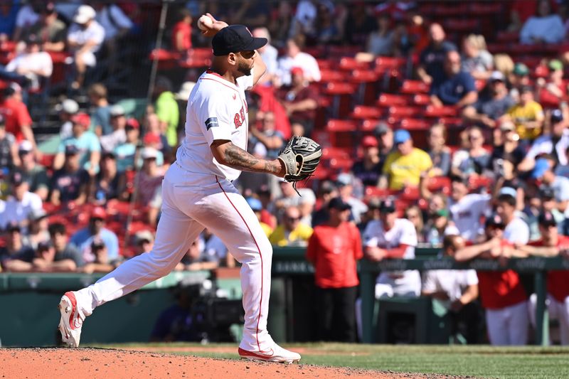 Aug 11, 2024; Boston, Massachusetts, USA; Boston Red Sox first baseman Dominic Smith (2) pitches against the Houston Astros during the ninth inning at Fenway Park. Mandatory Credit: Eric Canha-USA TODAY Sports