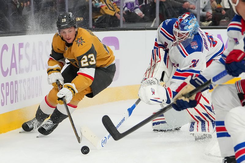 Nov 18, 2025; Las Vegas, Nevada, USA; New York Rangers goaltender Igor Shesterkin (31) tips the puck away from Vegas Golden Knights left wing Cole Reinhardt (23) during the first period at T-Mobile Arena. Mandatory Credit: Stephen R. Sylvanie-Imagn Images