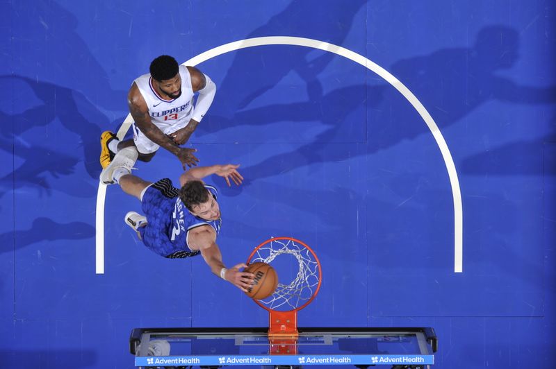 ORLANDO, FL - MARCH 29: Franz Wagner #22 of the Orlando Magic dunks the ball during the game against the LA Clippers on March 29, 2024 at the Kia Center in Orlando, Florida. NOTE TO USER: User expressly acknowledges and agrees that, by downloading and or using this photograph, User is consenting to the terms and conditions of the Getty Images License Agreement. Mandatory Copyright Notice: Copyright 2024 NBAE (Photo by Fernando Medina/NBAE via Getty Images)