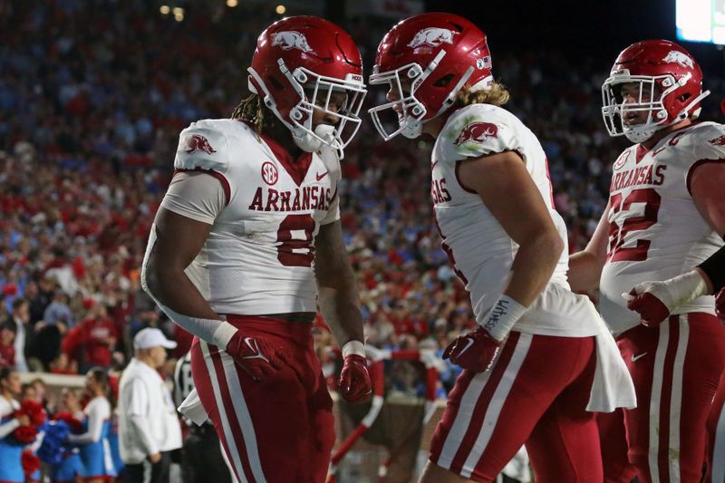 Oct 7, 2023; Oxford, Mississippi, USA; Arkansas Razorbacks tight end Ty Washington (8) reacts with wide receiver Isaac TeSlaa (4) after a touchdown during the second half against the Mississippi Rebels at Vaught-Hemingway Stadium. Mandatory Credit: Petre Thomas-USA TODAY Sports