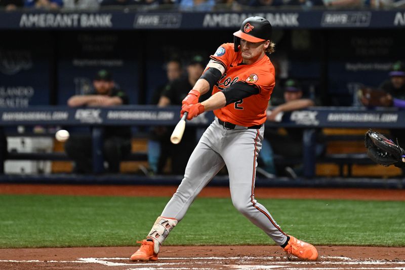 Aug 10, 2024; St. Petersburg, Florida, USA; Baltimore Orioles shortstop Gunnar Henderson (2) singles in the first inning against the Tampa Bay Rays at Tropicana Field. Mandatory Credit: Jonathan Dyer-USA TODAY Sports