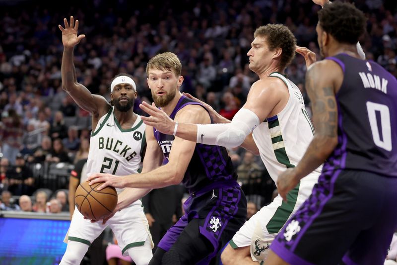 SACRAMENTO, CALIFORNIA - MARCH 12: Domantas Sabonis #10 of the Sacramento Kings is guarded by Brook Lopez #11 of the Milwaukee Bucks in the first half at Golden 1 Center on March 12, 2024 in Sacramento, California. NOTE TO USER: User expressly acknowledges and agrees that, by downloading and or using this photograph, User is consenting to the terms and conditions of the Getty Images License Agreement.  (Photo by Ezra Shaw/Getty Images)