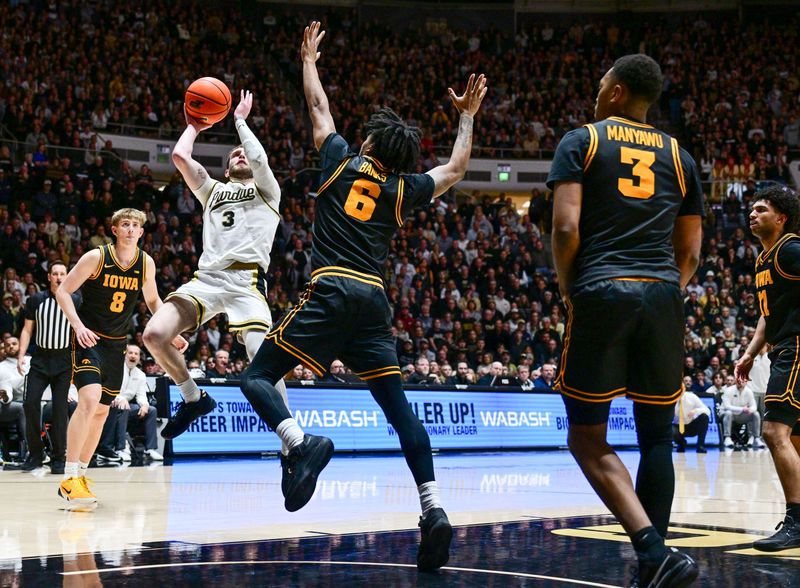 Jan 14, 2026; West Lafayette, Indiana, USA; Purdue Boilermakers guard Braden Smith (3) shoots the ball over Iowa Hawkeyes guard Tavion Banks (6) during the second half at Mackey Arena. Mandatory Credit: Marc Lebryk-Imagn Images