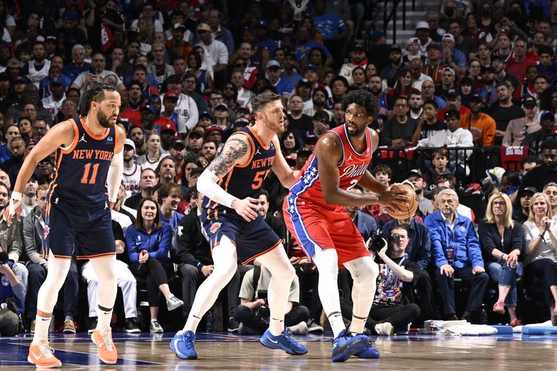 PHILADELPHIA, PA - APRIL 28: Joel Embiid #21 of the Philadelphia 76ers looks to pass the ball during the game against the New York Knicks during Round 1 Game 4 of the 2024 NBA Playoffs on April 28, 2024 at the Wells Fargo Center in Philadelphia, Pennsylvania NOTE TO USER: User expressly acknowledges and agrees that, by downloading and/or using this Photograph, user is consenting to the terms and conditions of the Getty Images License Agreement. Mandatory Copyright Notice: Copyright 2024 NBAE (Photo by David Dow/NBAE via Getty Images)