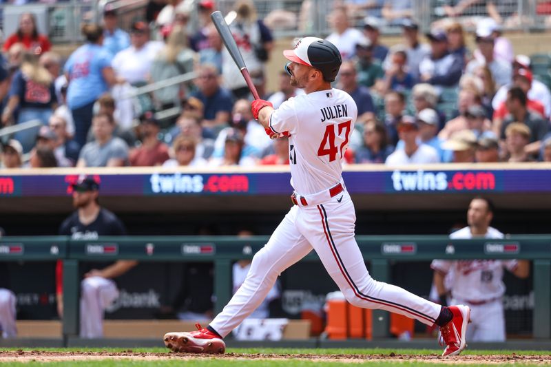 May 24, 2023; Minneapolis, Minnesota, USA; Minnesota Twins second baseman Edouard Julien (47) hits an RBI single against the San Francisco Giants during the second inning at Target Field. Mandatory Credit: Matt Krohn-USA TODAY Sports