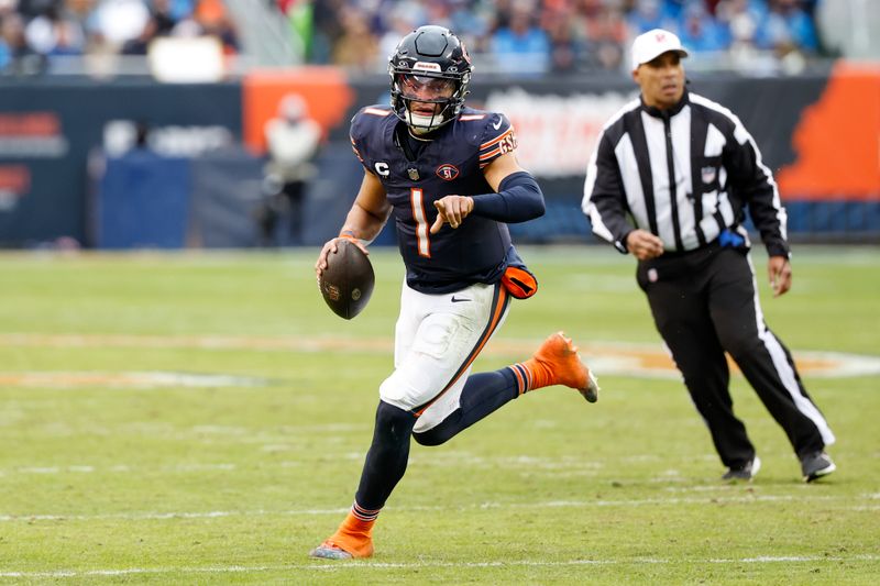 Chicago Bears quarterback Justin Fields (1) runs with the ball to score a touchdown against the Detroit Lions during the second half of an NFL football game, Sunday, Dec. 10, 2023, in Chicago. (AP Photo/Kamil Krzaczynski)