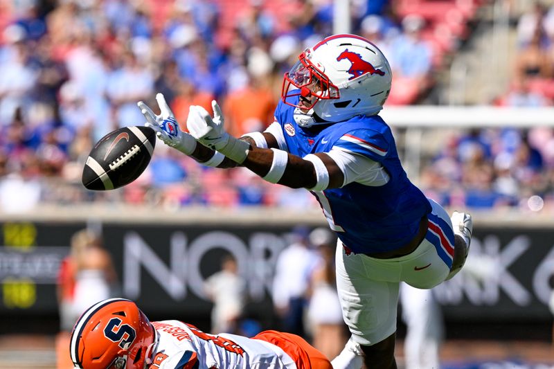 Oct 4, 2025; Dallas, Texas, USA; SMU Mustangs cornerback Deuce Harmon (7) leaps but cannot catch ball thrown by Syracuse Orange quarterback Rickie Collins (10) for an interception during the first half at Gerald J. Ford Stadium. Mandatory Credit: Jerome Miron-Imagn Images