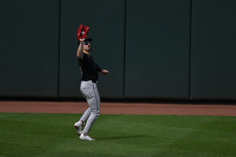 May 11, 2024; Baltimore, Maryland, USA;  Arizona Diamondbacks outfielder Lourdes Gurriel Jr. (12) catches a first inning fly bal against the Baltimore Orioles at Oriole Park at Camden Yards. Mandatory Credit: Tommy Gilligan-USA TODAY Sports