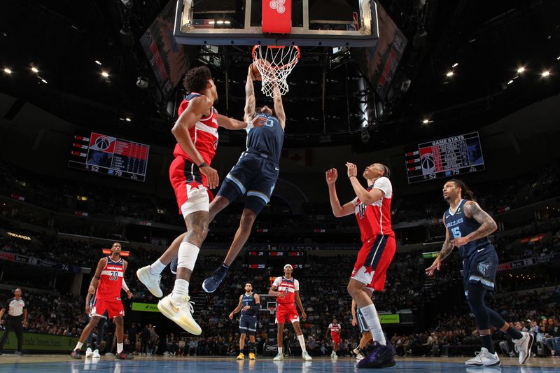 MEMPHIS, TN - NOVEMBER 8: Jaylen Wells #0 of the Memphis Grizzlies dunks the ball during the game against the Washington Wizards on November 8, 2024 at FedExForum in Memphis, Tennessee. NOTE TO USER: User expressly acknowledges and agrees that, by downloading and or using this photograph, User is consenting to the terms and conditions of the Getty Images License Agreement. Mandatory Copyright Notice: Copyright 2024 NBAE (Photo by Joe Murphy/NBAE via Getty Images)