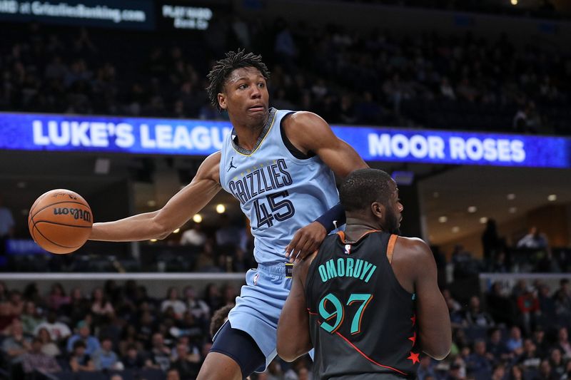 MEMPHIS, TENNESSEE - MARCH 12: GG Jackson #45 of the Memphis Grizzlies looks to pass against Eugene Omoruyi #97 of the Washington Wizards during the second half at FedExForum on March 12, 2024 in Memphis, Tennessee. NOTE TO USER: User expressly acknowledges and agrees that, by downloading and or using this photograph, User is consenting to the terms and conditions of the Getty Images License Agreement. (Photo by Justin Ford/Getty Images)