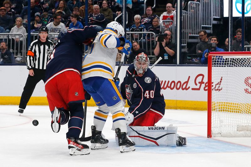 Oct 17, 2024; Columbus, Ohio, USA; Columbus Blue Jackets defenseman Ivan Provorov (9) blocks a shot in front of Columbus Blue Jackets goalie Daniil Tarasov (40) during the first period at Nationwide Arena. Mandatory Credit: Russell LaBounty-Imagn Images