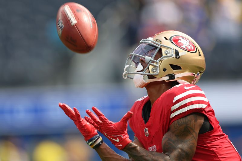 San Francisco 49ers wide receiver Jacob Cowing warms up before an NFL football game against the Los Angeles Rams, Sunday, Sept. 22, 2024, in Inglewood, Calif. (AP Photo/Ryan Sun)