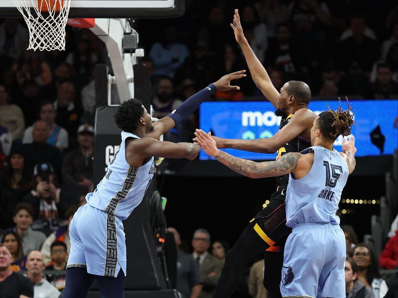 PHOENIX, ARIZONA - FEBRUARY 11: Kevin Durant #35 of the Phoenix Suns puts up a shot against Jaren Jackson Jr. #13 of the Memphis Grizzlies during the second half of the NBA game at Footprint Center on February 11, 2025 in Phoenix, Arizona.  NOTE TO USER: User expressly acknowledges and agrees that, by downloading and or using this photograph, User is consenting to the terms and conditions of the Getty Images License Agreement.  (Photo by Christian Petersen/Getty Images)