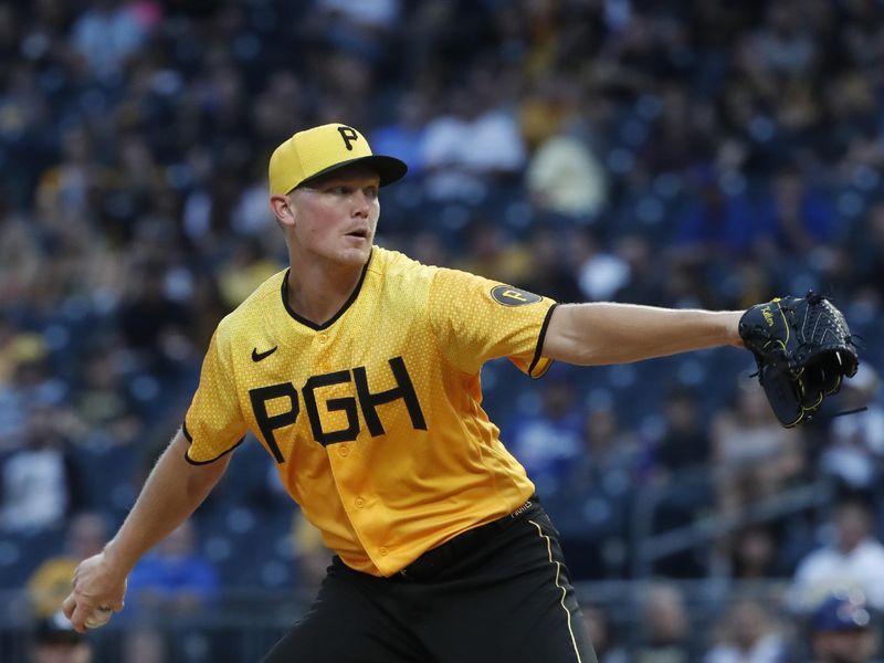 Aug 25, 2023; Pittsburgh, Pennsylvania, USA; Pittsburgh Pirates starting pitcher Mitch Keller (23) delivers a pitch against the Chicago Cubs during the first inning at PNC Park. Mandatory Credit: Charles LeClaire-USA TODAY Sports