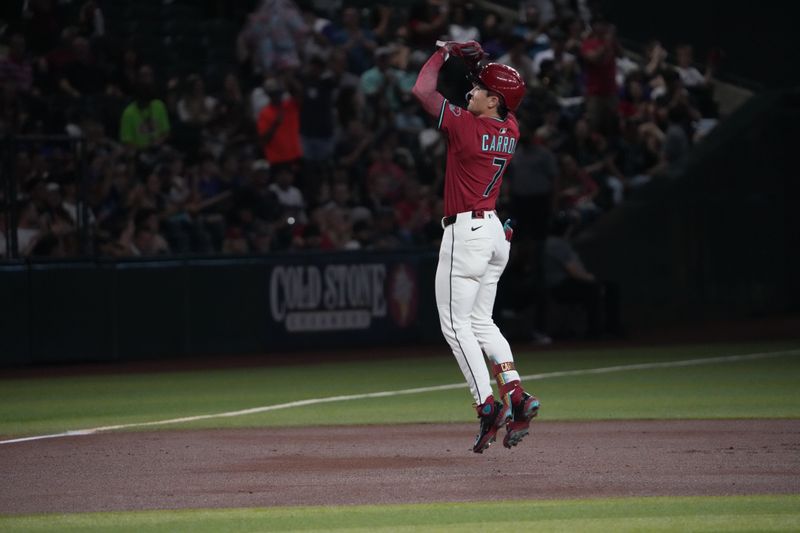 Aug 6, 2025; Phoenix, Arizona, USA; Arizona Diamondbacks outfielder Corbin Carroll (7) celebrates a solo home run against the San Diego Padres during the first inning at Chase Field. Mandatory Credit: Joe Camporeale-Imagn Images