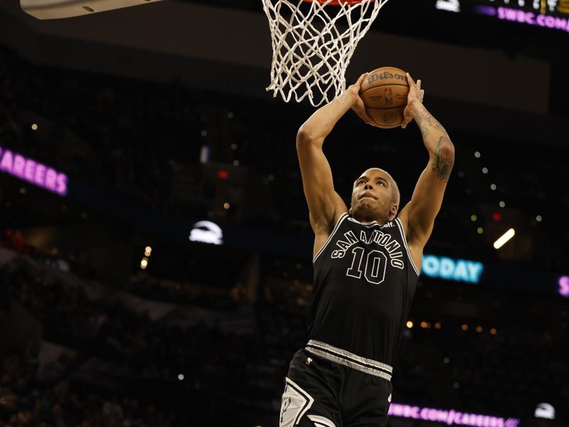 SAN ANTONIO, TX - MARCH 14: Jeremy Sochan #10 of the San Antonio Spurs dunks against the Orlando Magic in the first half at AT&T Center on March 14, 2023 in San Antonio, Texas. NOTE TO USER: User expressly acknowledges and agrees that, by downloading and or using this photograph, User is consenting to terms and conditions of the Getty Images License Agreement. (Photo by Ronald Cortes/Getty Images)