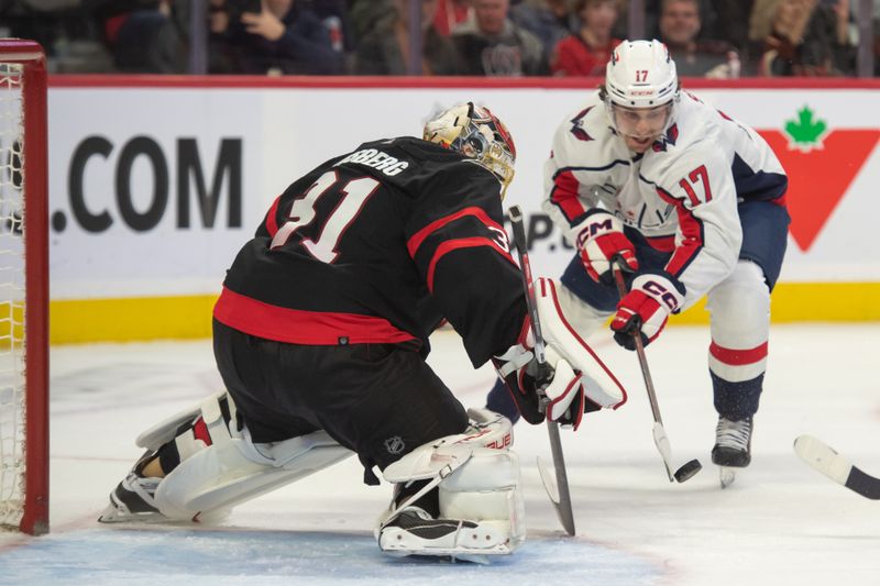 Oct 18, 2023; Ottawa, Ontario, CAN; Ottawa Senators goalie Anton Forsberg (31) makes a save in front of Washington Capitals center Dylan Strome (17) in the second period at the Canadian Tire Centre. Mandatory Credit: Marc DesRosiers-USA TODAY Sports