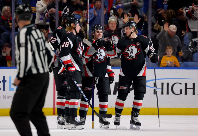 Jan 18, 2024; Buffalo, New York, USA;  Buffalo Sabres defenseman Rasmus Dahlin (26) celebrates his goal with teammates during the third period against the Chicago Blackhawks at KeyBank Center. Mandatory Credit: Timothy T. Ludwig-USA TODAY Sports