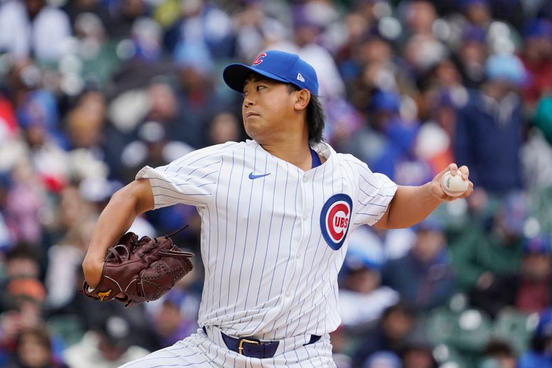 Apr 7, 2024; Chicago, Illinois, USA; Chicago Cubs pitcher Shota Imanaga (18) pitches against the Los Angeles Dodgers during the first inning at Wrigley Field. Mandatory Credit: David Banks-USA TODAY Sports