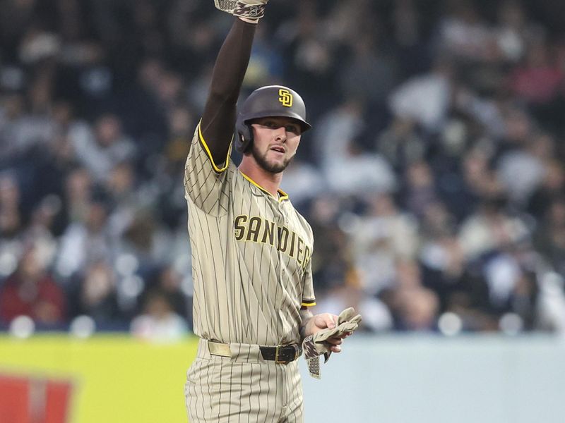 May 6, 2025; Bronx, New York, USA;  San Diego Padres center fielder Jackson Merrill (3) gestures after hitting a double in the first inning against the New York Yankees at Yankee Stadium. Mandatory Credit: Wendell Cruz-Imagn Images