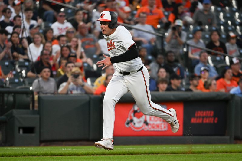 Apr 15, 2024; Baltimore, Maryland, USA;  Baltimore Orioles first baseman Ryan Mountcatle run home to score on outfielder Cedric Mullins (not pictured) sacrifice fly in the third inning against the Minnesota Twins at Oriole Park at Camden Yards. Mandatory Credit: Tommy Gilligan-USA TODAY Sports