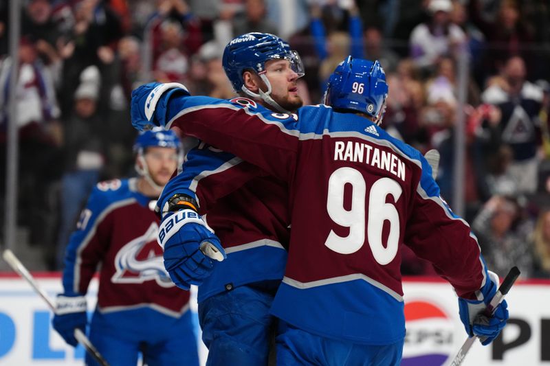 Jan 2, 2024; Denver, Colorado, USA; Colorado Avalanche right wing Valeri Nichushkin (13) celebrates his goal with right wing Mikko Rantanen (96) in the second period against the New York Islanders at Ball Arena. Mandatory Credit: Ron Chenoy-USA TODAY Sports