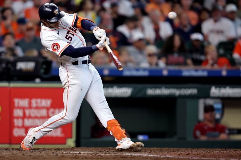 Sep 7, 2024; Houston, Texas, USA; Houston Astros shortstop Jeremy Peña (3) hits a three-run home run against the Arizona Diamondbacks during the sixth inning at Minute Maid Park. Mandatory Credit: Erik Williams-Imagn Images
