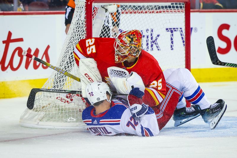 Oct 24, 2023; Calgary, Alberta, CAN; New York Rangers center Filip Chytil (72) and Calgary Flames goaltender Jacob Markstrom (25) collide during the third period at Scotiabank Saddledome. Mandatory Credit: Sergei Belski-USA TODAY Sports