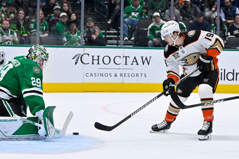 Jan 25, 2024; Dallas, Texas, USA; Dallas Stars goaltender Jake Oettinger (29) stops a shot by Anaheim Ducks right wing Troy Terry (19) during the first period at the American Airlines Center. Mandatory Credit: Jerome Miron-USA TODAY Sports